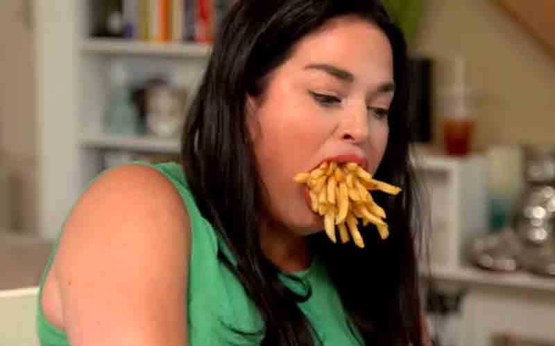 She has the world's biggest mouth and can shove two cheeseburgers in it at once