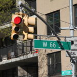 West 66th Street green traffic sign in New York